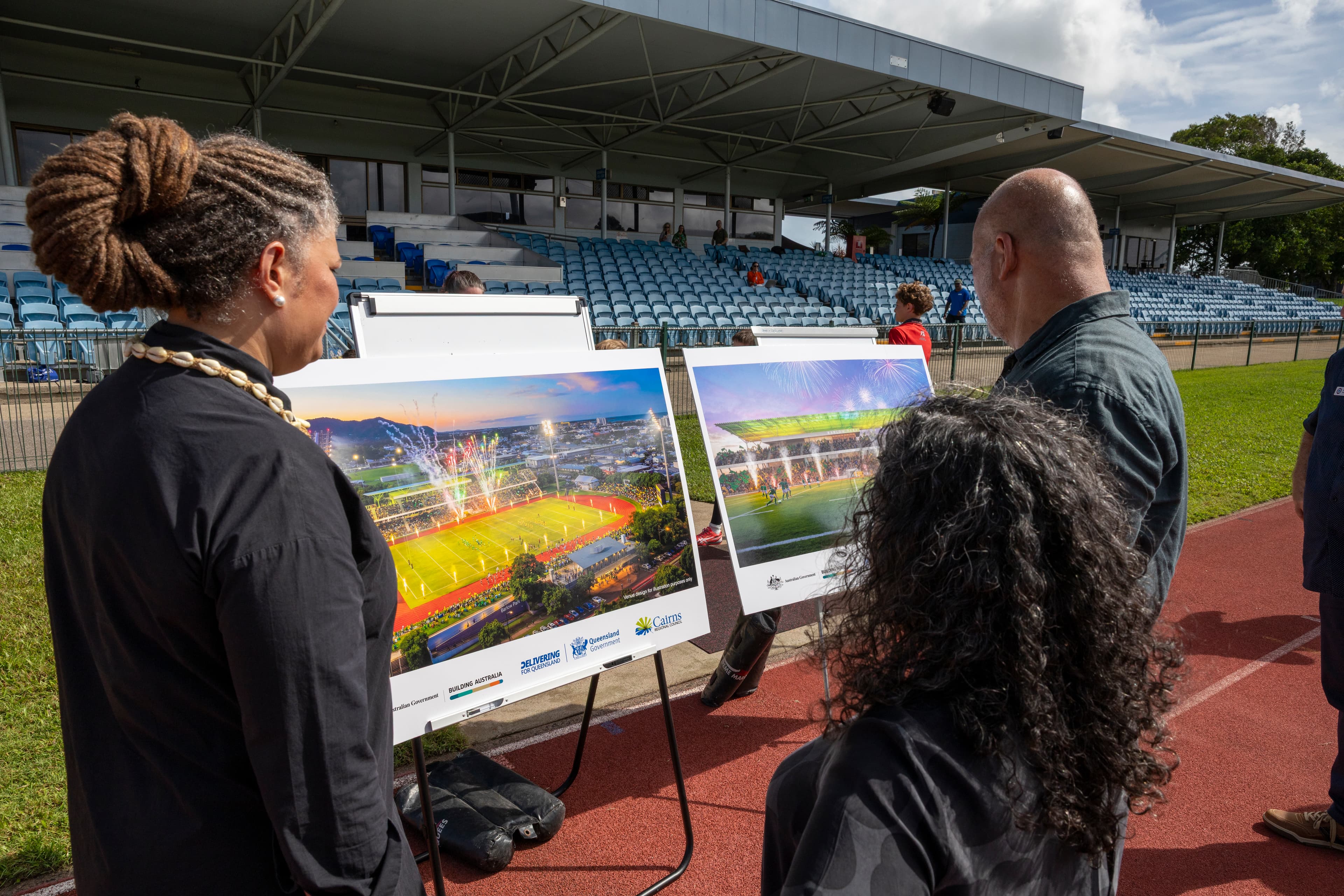 Members of Indij Design looking at the new Barlow park Stadium Renders in Cairns
