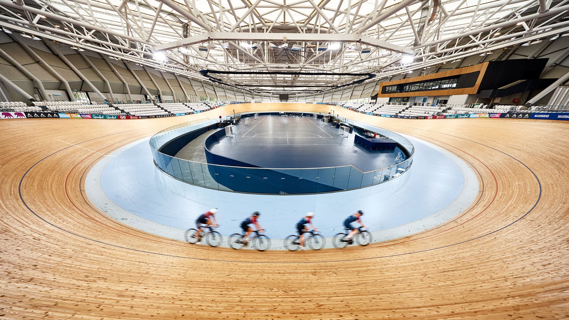 Four cyclists on Anna Meares Velodrome 